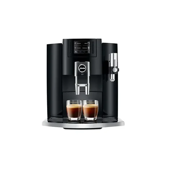 Máquina de café espresso automática con dos tazas servidas.