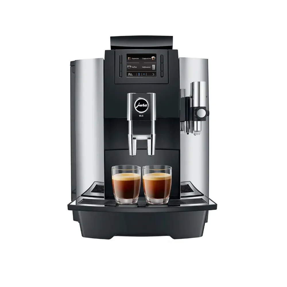 Máquina de café espresso moderna con dos tazas servidas.